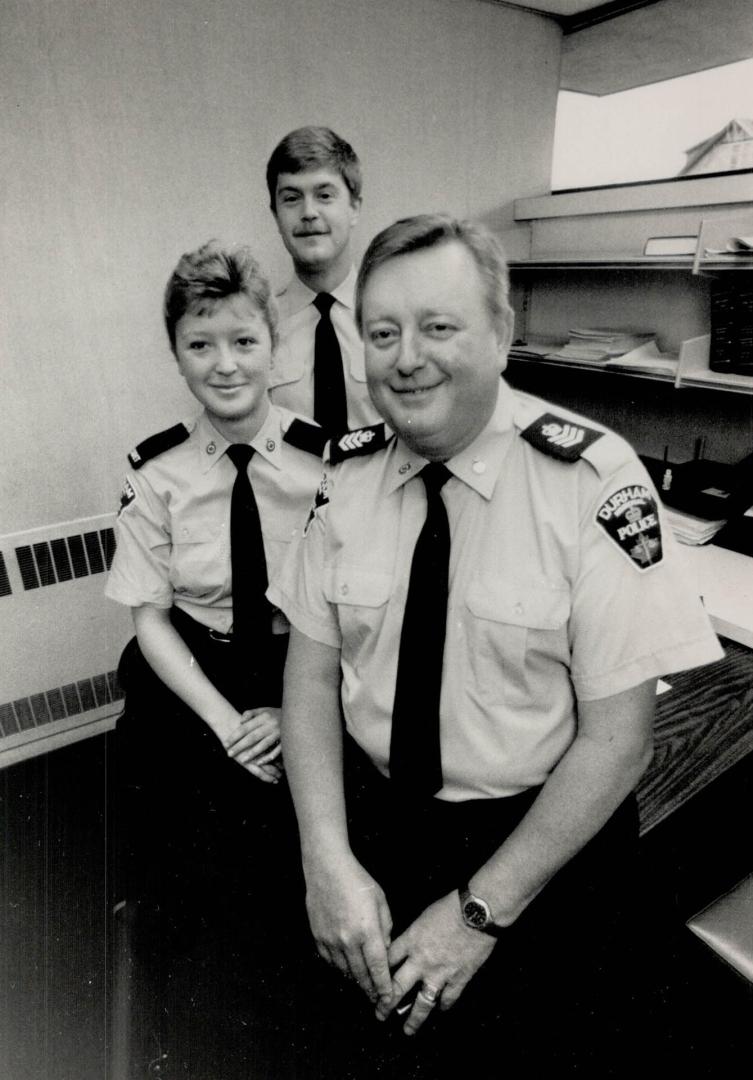Family tradition: Durham Region's Joe Loughlin, foreground, with police cadet daughter Sherri and son Dave, a constable in Metro's 41 Division