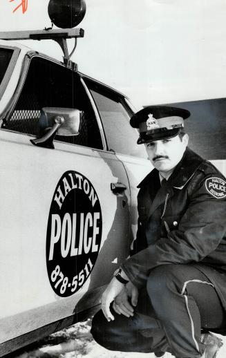 Regional constable Don Leroux, His cap still bears an Oakville police badge