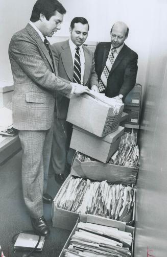 Paper Avalanche examined by, from left, Staff Sgts