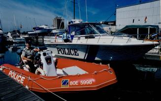 Long arm of the law on Lake Ontario, RCMP Constable Ray Usarewicz, in the foreground, and Sergeant Mark Crawley of Peel Regional Police Marine Unit, C(...)