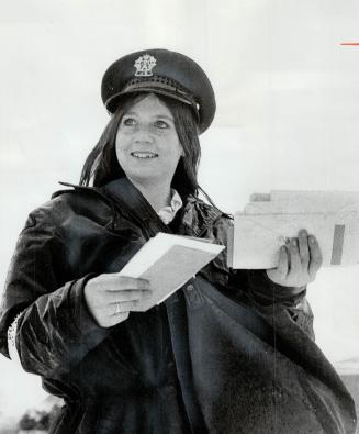Margaret Morgan at work, The mail's being delivered by a female