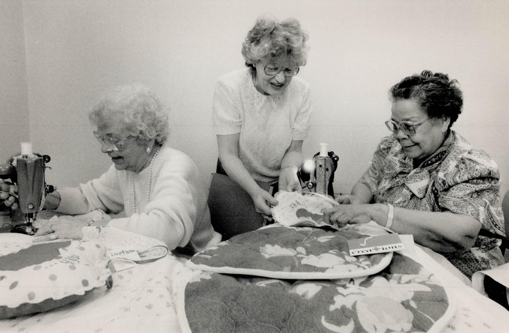 Helping hands, Red Cross Sewing group members work on crafts they sell under the Creations label to raise money for domestic and foreign aid programs.(...)
