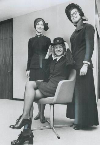 New Salvation Army uniform, including short skirt and bowler hat, is modelled by Barbara Burrows (seated)