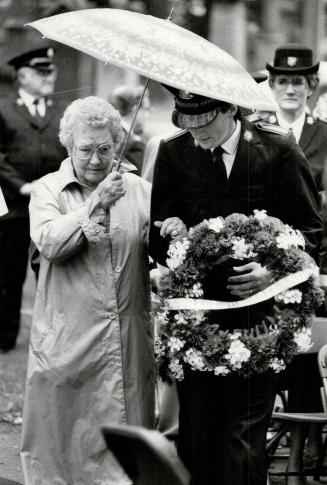 Oldest survivor: Etobicoke Salvationist Paul Ivany helps Grace Martyn, 80, place a wreath on a memorial to the 150 Army victims of the 1914 sinking of the Empress of Ireland