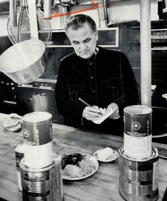 Brig. Cyril Everitt checks sample dinner and menu