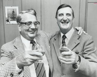 Former Foes, Karl Claessens, left, and Pat Russell toast their post-World War II friendship with snifters of cognac