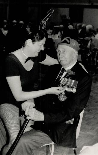 Hero's welcome: Susan Oakley, a volunteer waitress at a luncheon at the Legion's 258 Branch greets John Finnimore, 98, who was a sergeant-major wounded at Ypres