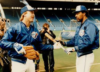 Jays' pitchers making a hit, If this is 1985, it must mean that pitchers have to bat in the World Series (but not in the playoffs) and Jim Acker (abov(...)