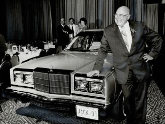 A brand new car for the ex-Chief, Retiring Metro police chief Jack Ackroyd strikes a pose beside his brand new, luxurious Chrysler New Yorker -- compl(...)