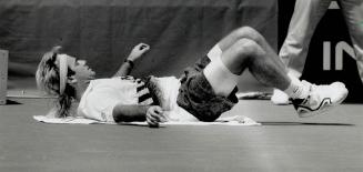 Down for the Count: Andre Agassi, top seed in the Canadian Open, was knocked flat in the quarterfinals by Michael Chang, 4-6, 7-5, 7-5