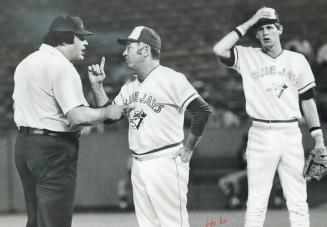 What's it all about? Jays' Danny Ainge (right) can't seem to figure out what's going on between umpire Ken Kaiser and Jays' manager Roy Hartsfield. Ha(...)