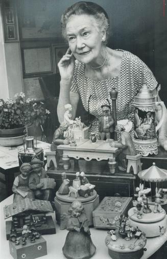 Mrs. Kate Aitken, during her news collecting travels, picked up music boxes