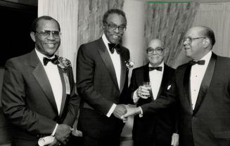 Community pride: Lieutenant-Governor Lincoln Alexander, left, receives congratulations from Prince Hall Masons Henry Wright, centre, and Ontario Ombudsman Dan Hill