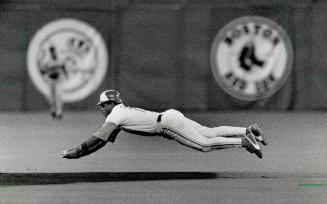 Up and at 'em: Robble Alomar takes a flying leap at second base for a steal last night in game against Twins