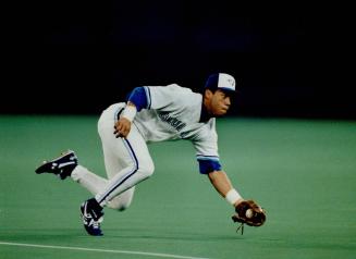 He's first at second: Robbie Alomar shows why he was named the AL's Gold Glove winner with this brilliant snag during Game 5 of the World Series