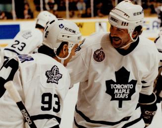 What a laugher: Glenn Anderson is all smiles after being congratulated by Doug Gilmour for one of his goals in last night's one-sided win over Tampa