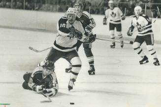 Hustling: Leaf's John Anderson was quick to take advantage of slip by Blues' Joe Micheletti, turning loose puck into a breakaway goal, capped by a nice deke on goalie Ed Liut