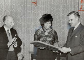 Framed copy of the Ontario Human Rights Code was presented to Miss Anderson yesterday by Premier John Robarts