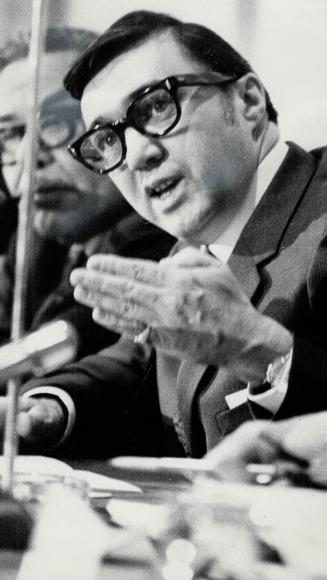 Lorenzo big canoe, chairman of meeting, and Robert Andras, minister responsible for Indian affairs, hear opinions on proposed amendments to Indian Act