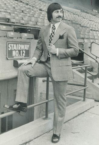 Zenon Andrusyshyn, Toronto Argonaut kicker known as the Big Z, wears a glen check suit by Pierre Cardin of Paris