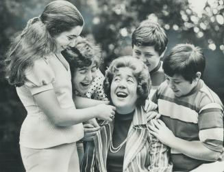 Mother the MP, Ursula Appolloni laughs good-naturedly at the teasing of her children Suzanne, 14, Luisa, 15, Andrew, 13, and Simon, 11. Mrs. Appolloni(...)