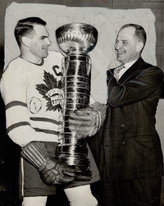 Captain Syl and Coach Hap Day admire the Stanley Cup which the Leafs wrested from Canadiens