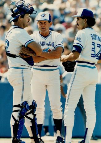 Hail and farewell: Pitcher Luis Aquino, at the mound with Ernie Whitt and manager Jimy Williams, beat Twin yesterday for his first big league win, but was soon on his way back to Syracuse