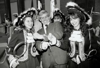 A different kind of chain of office wraps the wrists of Mayor Wayne Arthurs of Pickering, put on by German Canadian Club dancers Sandy Lucchese (left)(...)
