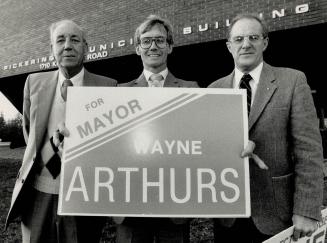 And the winner is: . . . Wayne Arthurs holds his campaign sign in the mayoral race in Pickering against opponents Gordon Potts, left, and George Ashe