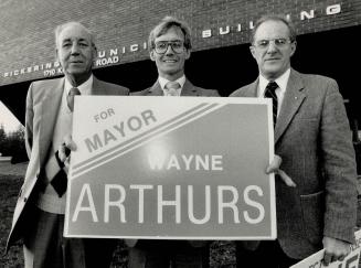 And the winner is: . . . Wayne Arthurs holds his campaign sign in the mayoral race in Pickering against opponents Gordon Potts, left, and George Ashe