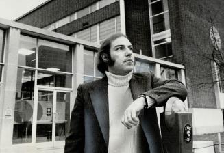 Roy Ascott stands in front of the Ontario College of Art building which, he claims, is an expensive white elephant for the taxpayer to feed