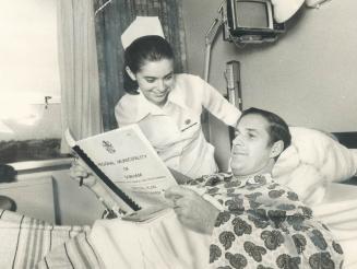 Mayor's on the job in bed. Confined to Ajax-Pickering Mayor George Ashe of Pickering with nurse Patricia Meek kept up with with telephone calls to cou(...)