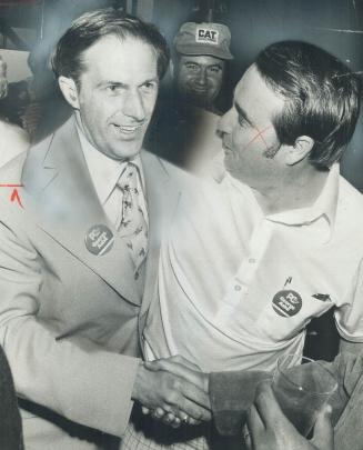 Pickering Mayor George Ashe (left) is congratulated by jack Bateson, president of the Ajax Progressive Conservative Association, after defeating the f(...)