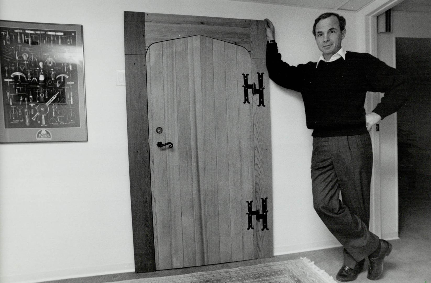 Bottled up: Custom-made door to Tony Aspler's wine cellar is 2 inches thick and weighs 125 pounds