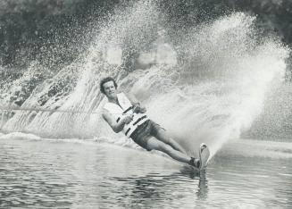 Canadian champ on the move. Water skier George Athans is defending his professional water skiing championship on weekend at Centre Island while pursui(...)