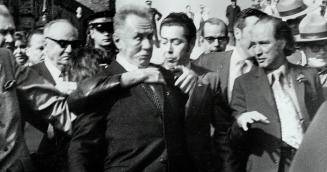 Shouting 'Vive Free Hungary' leather-jacketed 27-year-old Geza Matrai, of Toronto, leaps on back of Soviet Premier Alexei Kosygin as he walks with Pri(...)