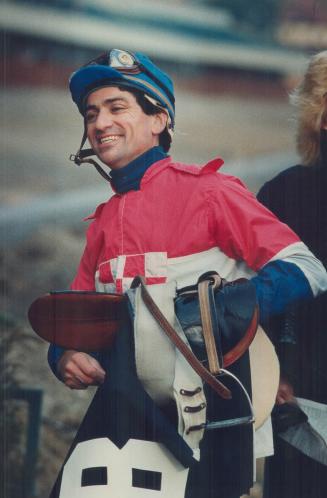 Desire to win: Larry Attard, above, and left, riding Backwinder to Victory, has twice won the Sovereign Award as Canada's outstanding jockey