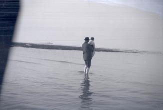 Arthur Conan Doyle at the seaside with his son Denis [D]