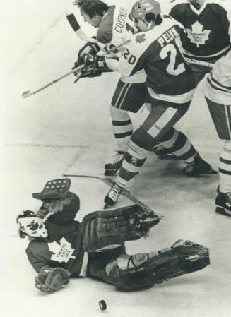 Special to Toronto Star . . Goal tender Mike Palmateer makes a save against Canadiens speedster Yvan Cournoyer, as Mike Pelik mives him out of the play