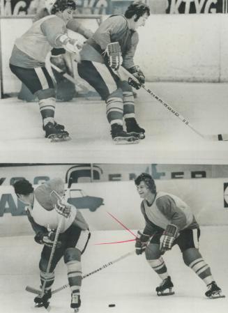 Hold on there! Boston Bruins' superstar Bobby Orr isn't about to let Team Canada teammate Rod Seiling of New York Rangers by without a struggle as he (...)