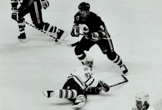 Cilmour lands: The Flames were anxious to take Doug Gilmour out of play and they did on this occasion last night as Calgary's Chris Dahlquist looks on