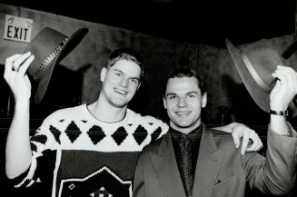 Head cases: Maple Leaf rookies Rob Pearson (left) and Alexander Godynyuk need some protection against cold after teammates took the shears to their heads