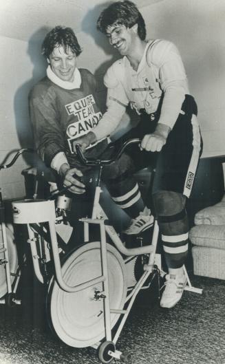 Easing up: With Team Canada going against the Finns tonight in its first Canada Cup game, Denis potvin eases tension on exercise bike for teammate Ray Bourque in their last workout
