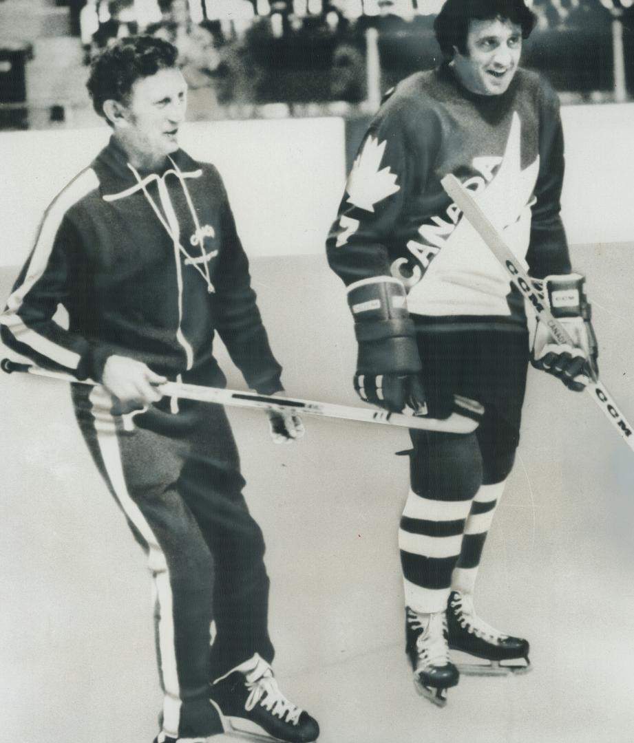Phil Esposito and coach Robby Kromm on the ice at Team Canada's training camp work out for the upcoming Canada-Russia series. Fan (below) complains he(...)