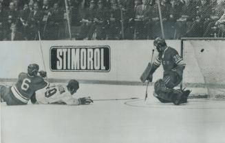 With 126 Seconds left to play, Team Canada's Paul Henderson lies sprawled in front of the Russian net with a Soviet defenceman wrapped around his legs(...)