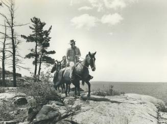 Riding is one of the popular activities in the Killarney district, where these riders take their horses amidst the rocks along Georgian Bay. Vehicles are forbidden in the 85,000-acre provincial park