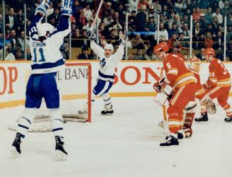 Back in front: Gary Leeman and Eddie Olczyk celebrate after Rob Ramage's slapper from the point found the mark with just 3:35 left in the game to give Leafs a 6-5 win in the see-saw contest