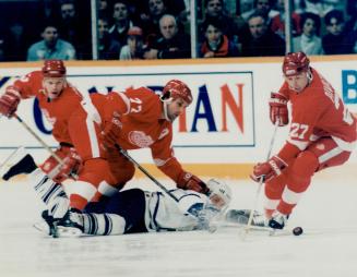 Paul Coffey Flattens, Ynic Perreault, While Kris Draper, Circles and Micah Alvazoff pick up loose puck