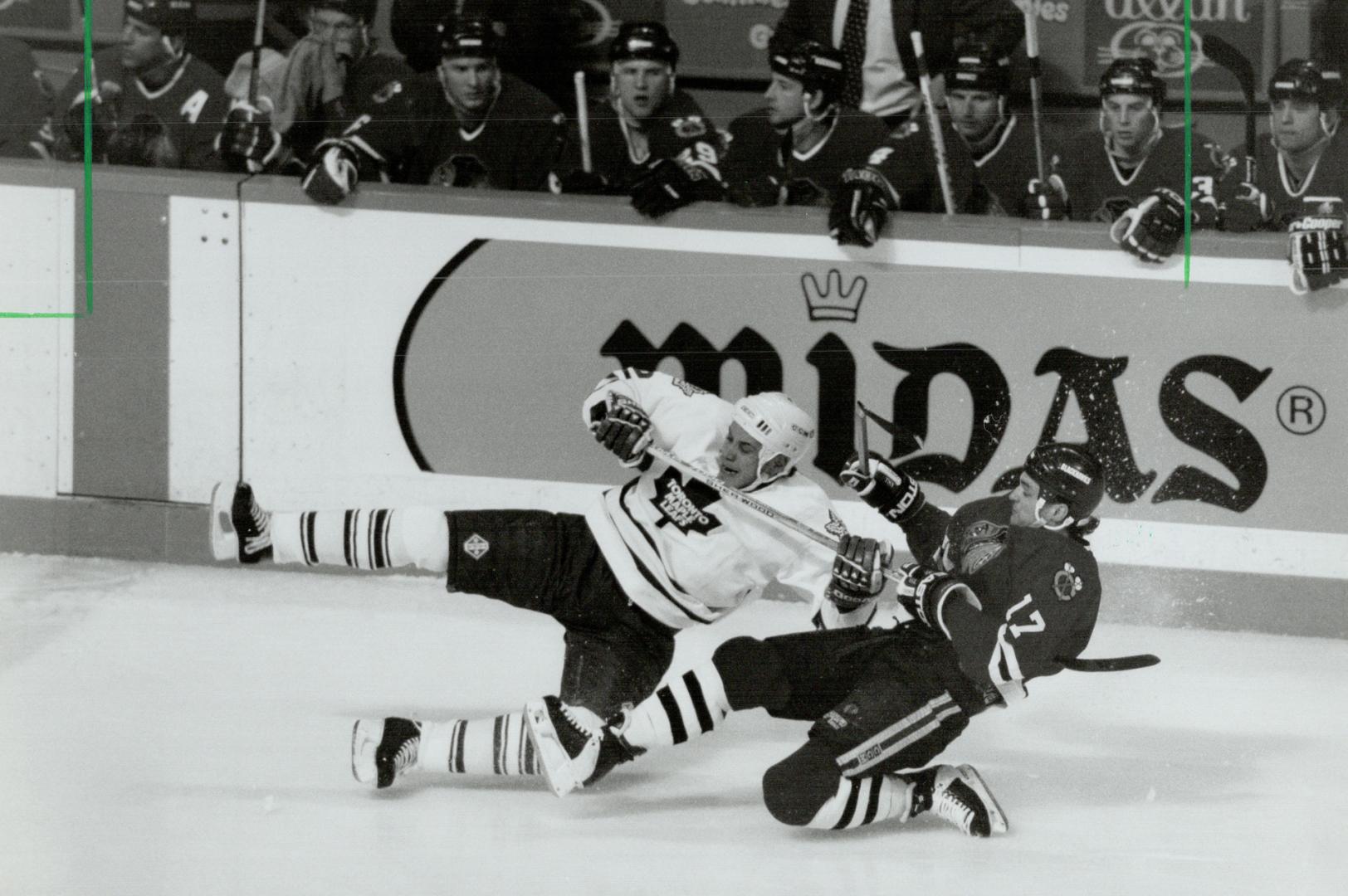Hawk on a skewer: Chicago's Joe Murphy, right, has a firm grip on Sylvain Lefebvre's stick during last night's game at Gardens