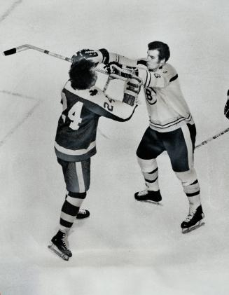 Sticks up . . . players ready to duel. Bruins' Ken Hodge (8), Leafs' Brian Glennie (24)